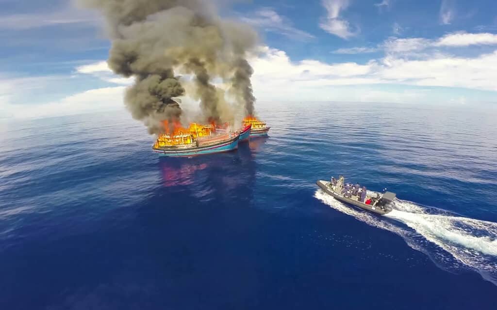 illegal fish boats burning in Palau aerial drone shot