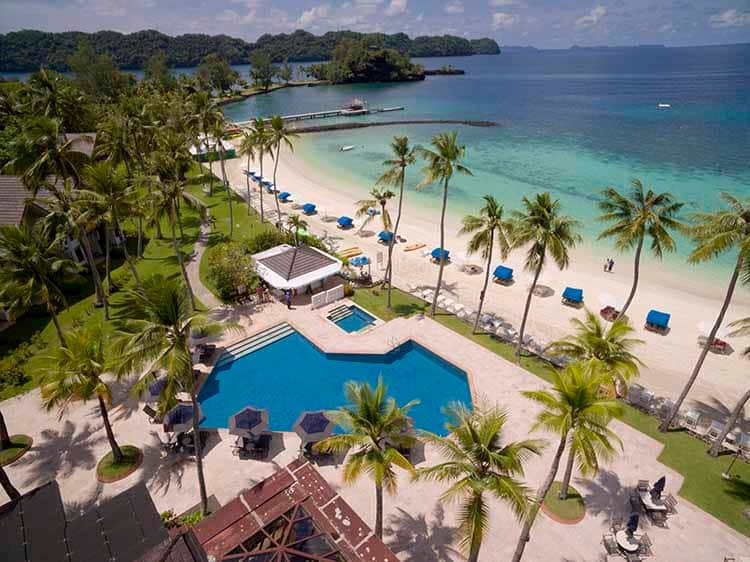 Palau resort aerial drone photo beach swimming pool palm trees