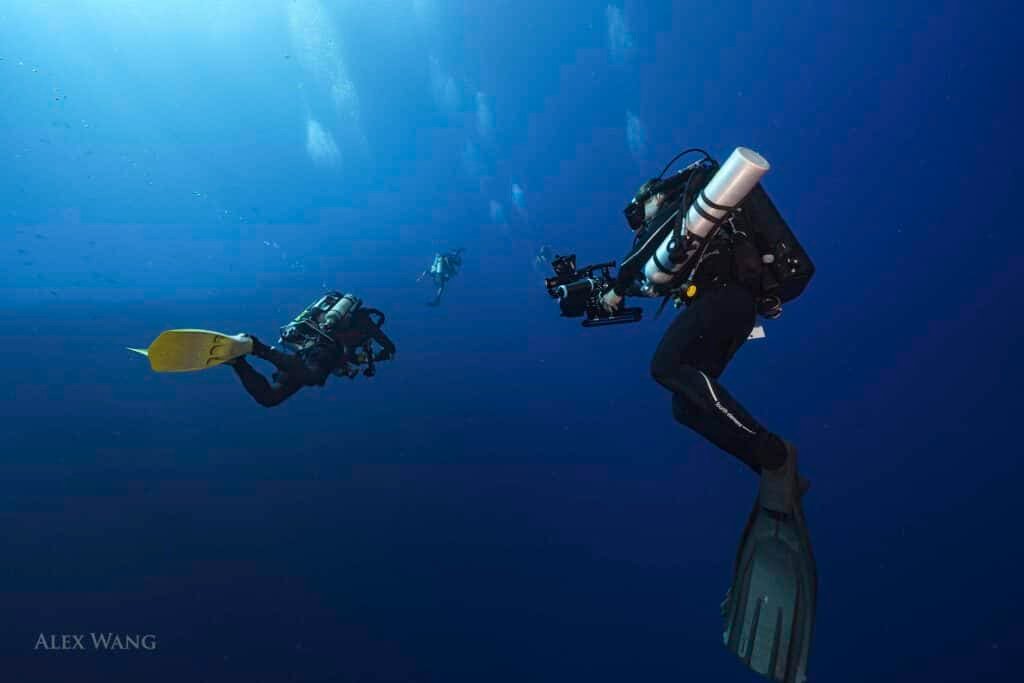 Rebreather divers in deep blue water