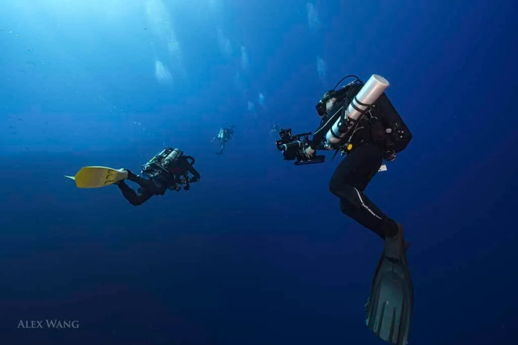 Rebreather divers in deep blue water