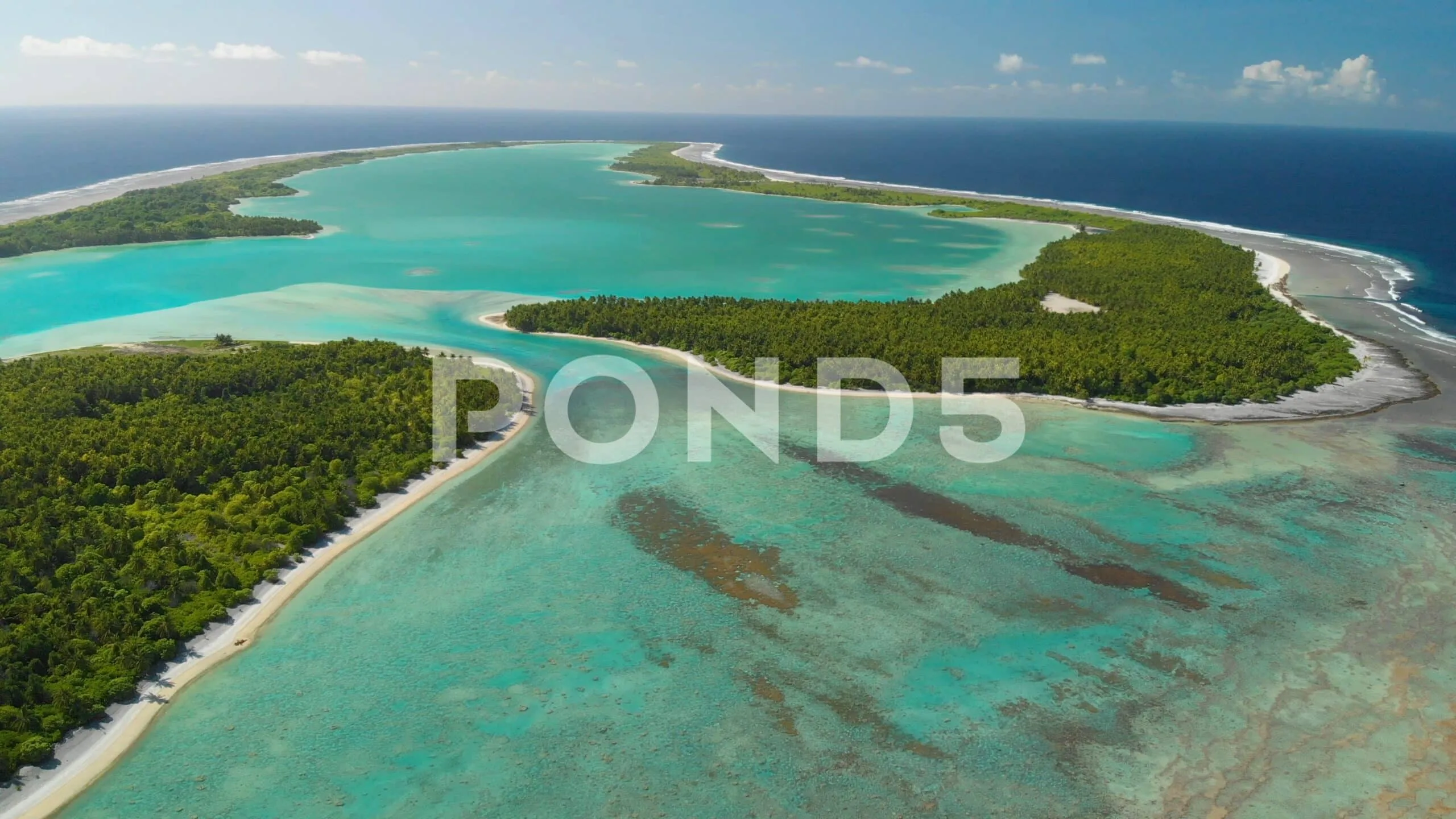 Aerial Shot Descending Towards Tropical Atoll In The Pacific
