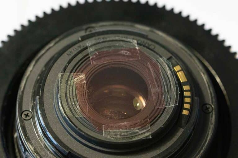 A red filter taped to the inside of a lens for underwater colour correction